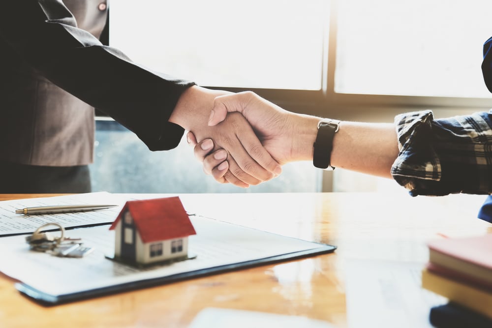 Focus,On,The,Congratulatory,Handshake.,The,Real,Estate,Agent,Agrees