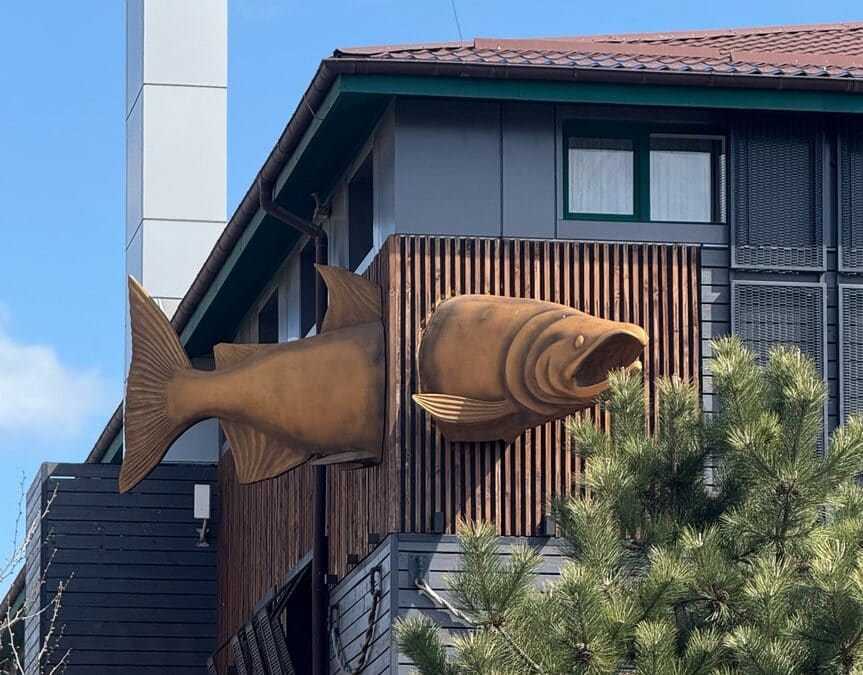 Unique,House,With,Fish,Sculpture,Protruding,From,Wall